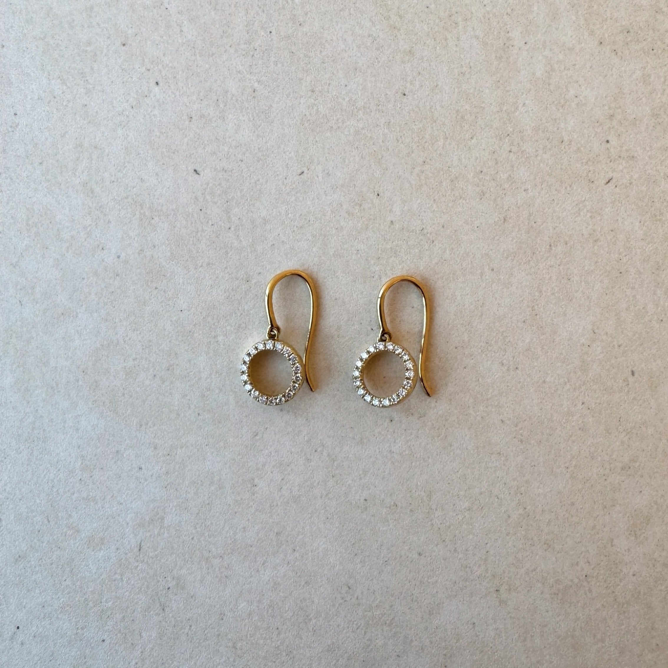 Pair of 18ct gold Hayes drop earrings featuring delicate round brilliant lab-grown diamonds cascading in a round silhouette, set against a white backdrop.