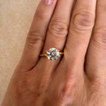 Close-up of a 1.52 carat Old European cut lab-grown diamond set in a yellow gold solitaire ring on a hand. Showcasing custom engagement ring designs available at MOHSTEN in Auckland, NZ.