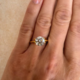 Close-up of a 1.52 carat Old European cut lab-grown diamond set in a yellow gold solitaire ring on a hand. Showcasing custom engagement ring designs available at MOHSTEN in Auckland, NZ.