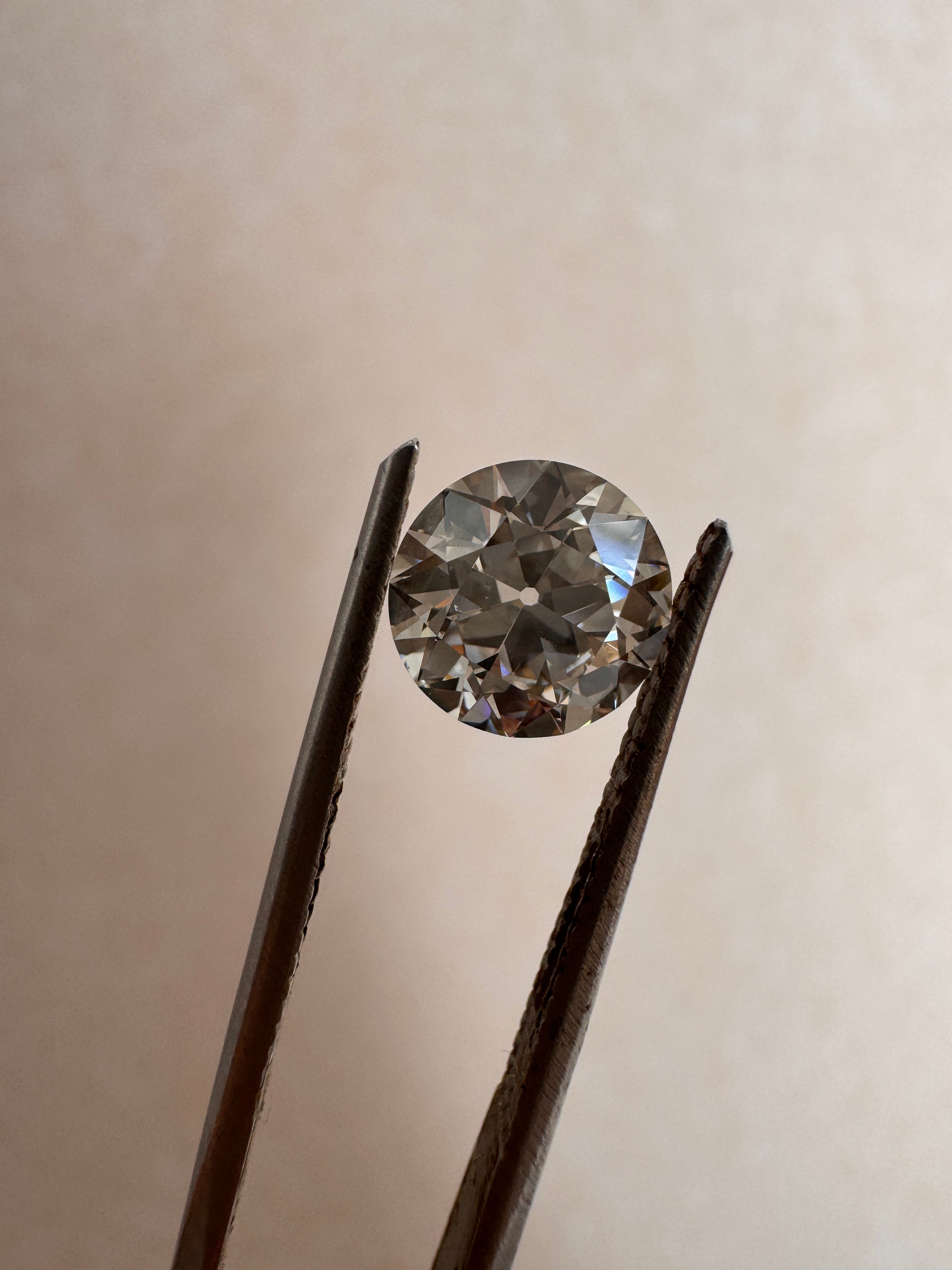 1.52ct Old European cut lab diamond held in stone holder, showcasing vintage facets for MOHSTEN custom rings in Auckland, NZ.