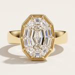 A yellow gold engagement ring concept featuring a 2.09ct oval step cut lab diamond in an architectural setting. A bespoke custom design by MOHSTEN jewellery studio in Auckland, New Zealand.