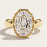 A yellow gold engagement ring concept featuring a 2.09ct oval step cut lab diamond in an architectural setting. A bespoke custom design by MOHSTEN jewellery studio in Auckland, New Zealand.