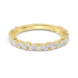 Gold ring with marquise and round shaped diamonds on a white background