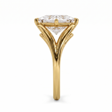 Gold ring with a diamond on a white background