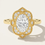 MOHSTEN The Capri vintage scalloped milgrain halo oval engagement ring in 18ct yellow gold.