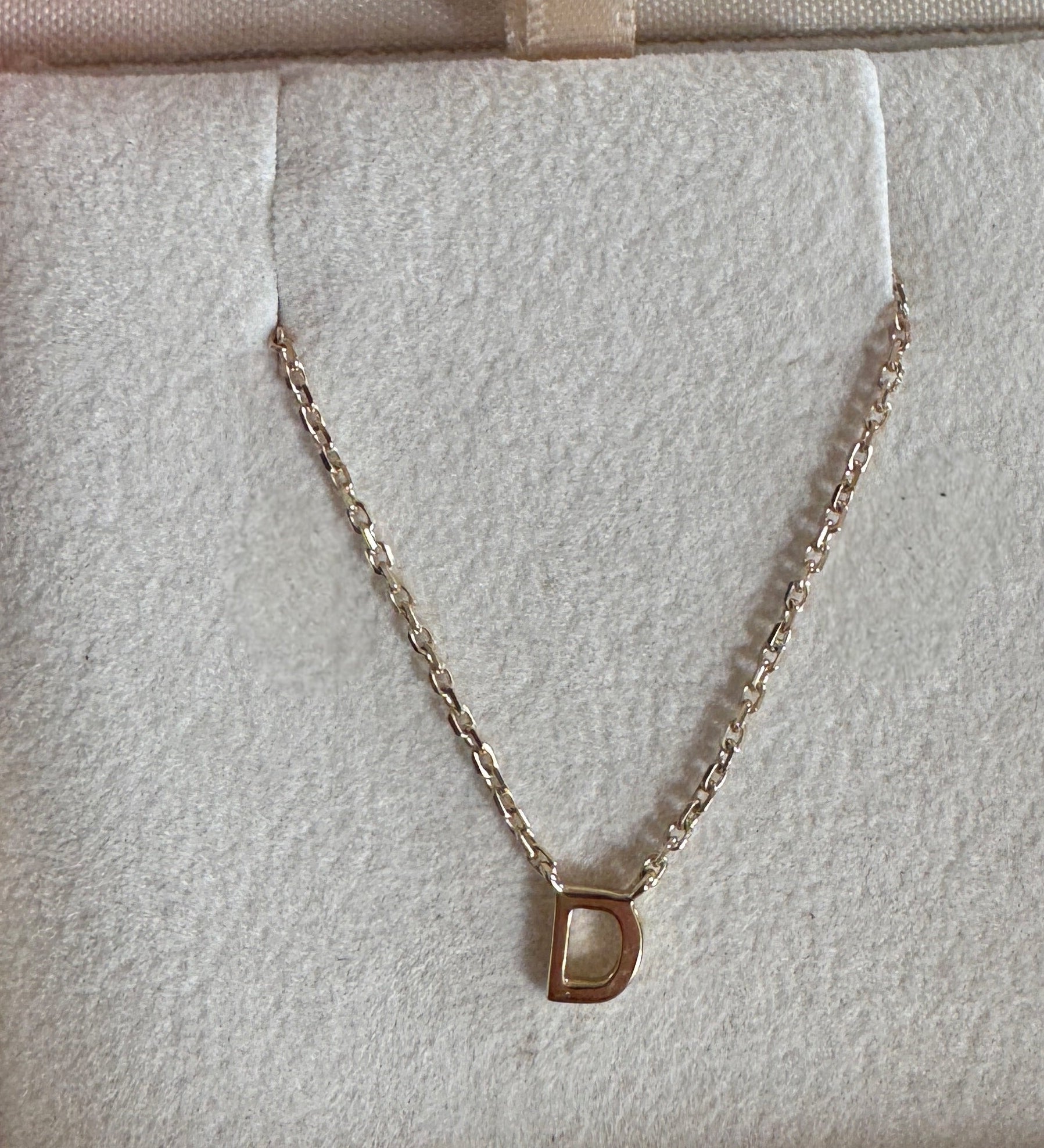 Necklace with a pendant in an open jewelry box