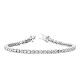 Detail of four-claw setting holding round diamond in polished white gold