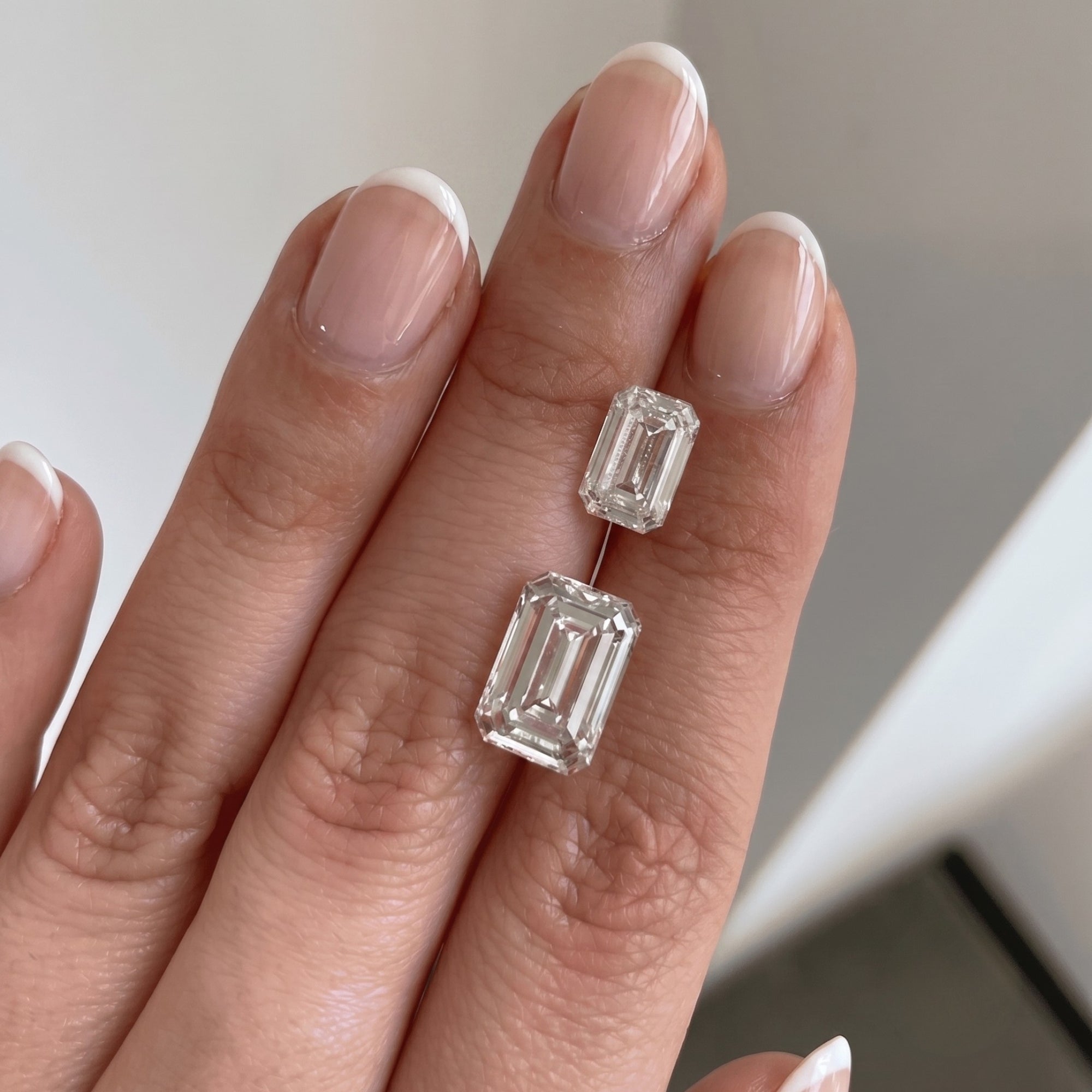 Diamond on a hand with a neutral background