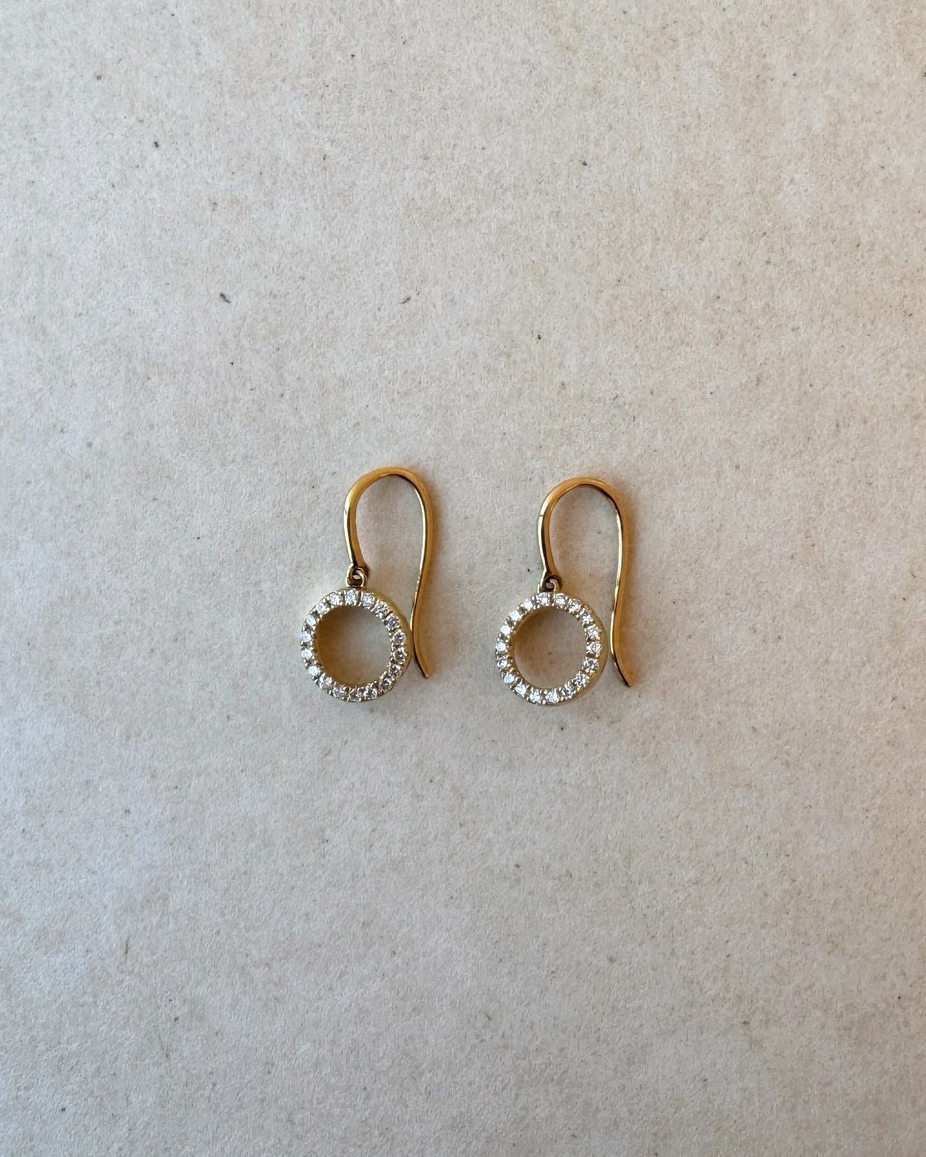 Pair of 18ct gold Hayes drop earrings featuring delicate round brilliant lab-grown diamonds cascading in a round silhouette, set against a white backdrop.
