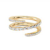 A gold-colored band ring with multiple layers and inset with emerald and round brilliant cut lab grown diamonds.