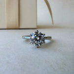 Round diamond ring on background