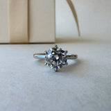 Round diamond ring on background