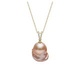Pearl necklace with gold chain on a white background