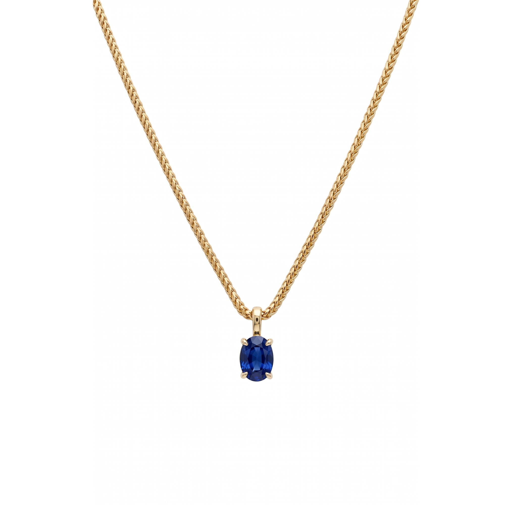 Gold necklace with a blue gemstone pendant on a white background