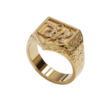 Gold signet ring with intricate designs on a white background