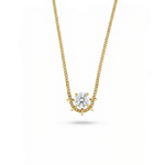 Gold necklace with a diamond pendant on a white background