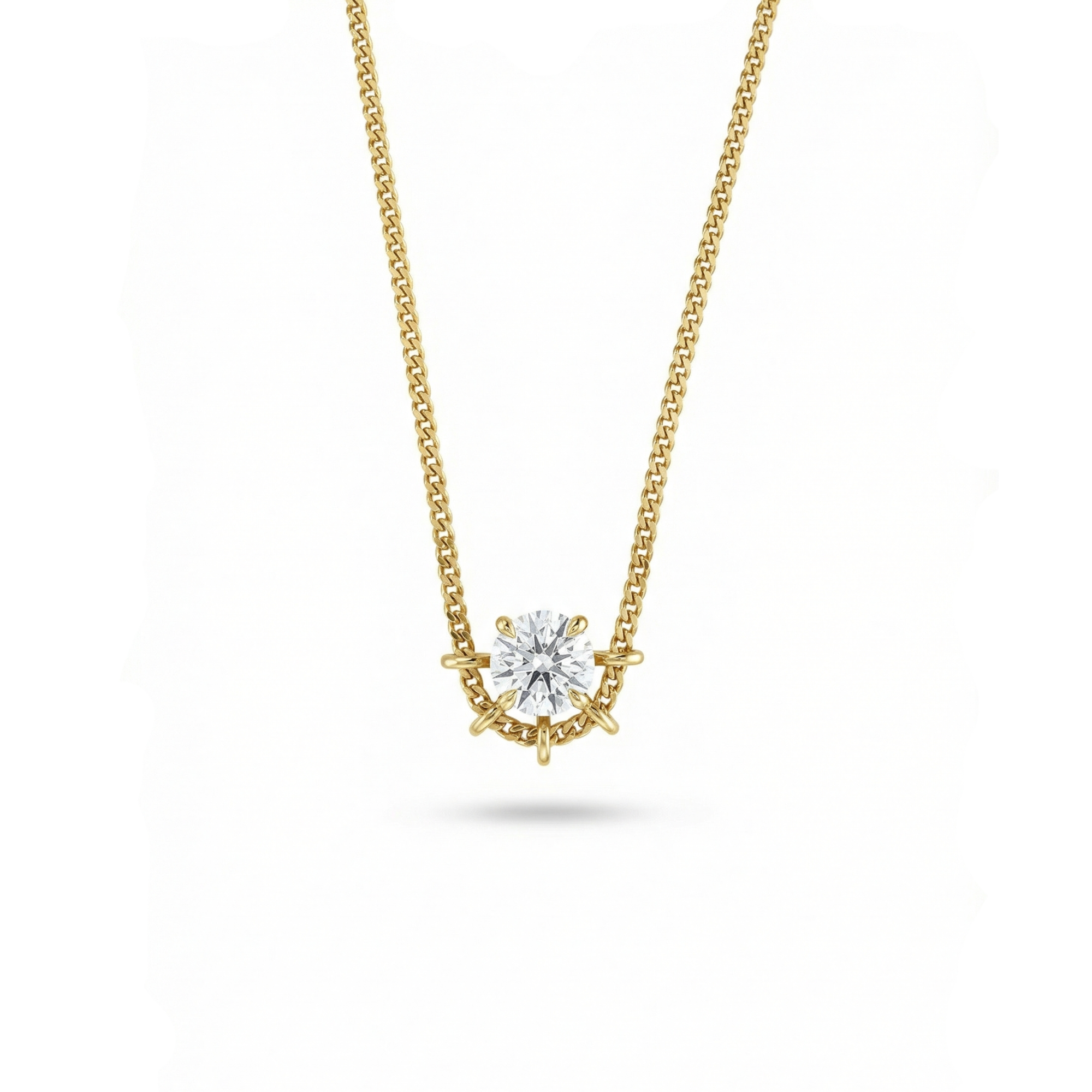 Gold necklace with a diamond pendant on a white background