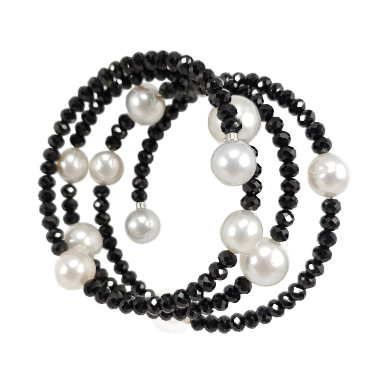 Black beaded necklace with white pearls on a white background