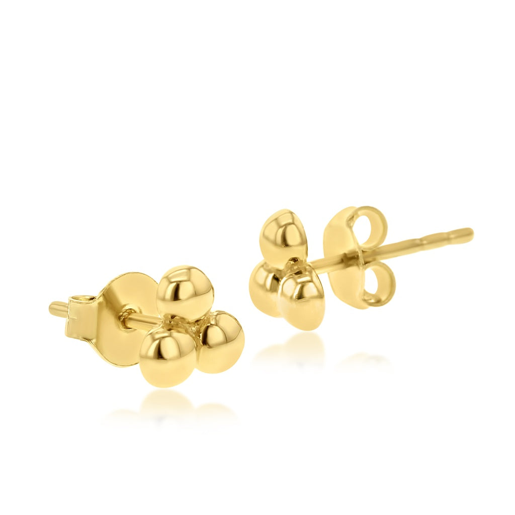 Gold stud earrings on a white background