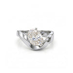 white gold ring with a pear-shaped diamond on a white background