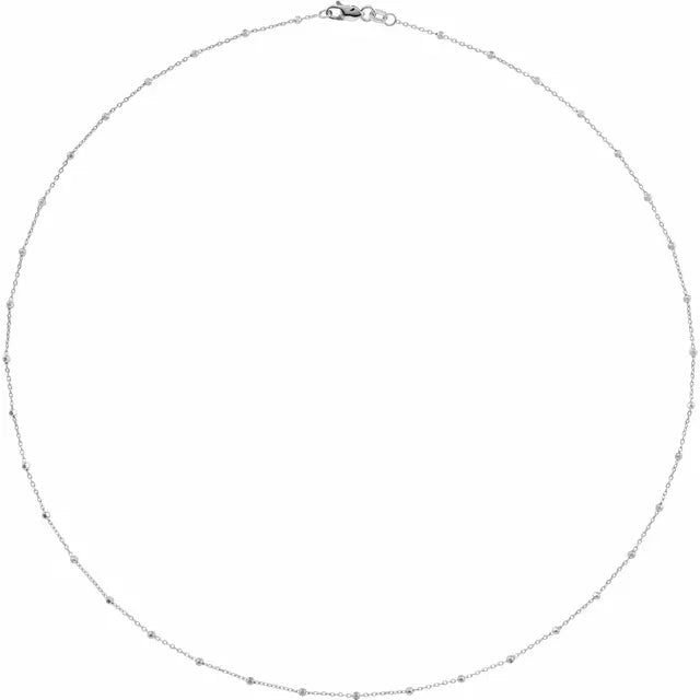 Flat lay of Beaded Cable Necklace white gold 40 cm length on neutral background