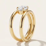 Side profile view of the MOHSTEN Beaufort pear diamond double band engagement ring in 18ct yellow gold showcasing the parallel split-shank architecture and the East-West stone setting.
