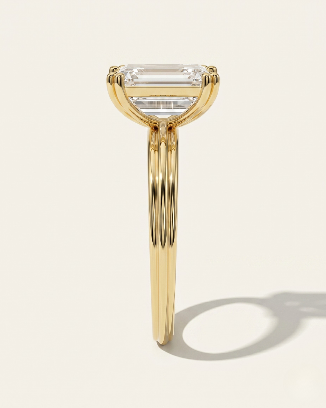 End profile view of the MOHSTEN Brooklyn engagement ring in 18ct yellow gold highlighting the architectural double-claw basket design and signature fluted band.