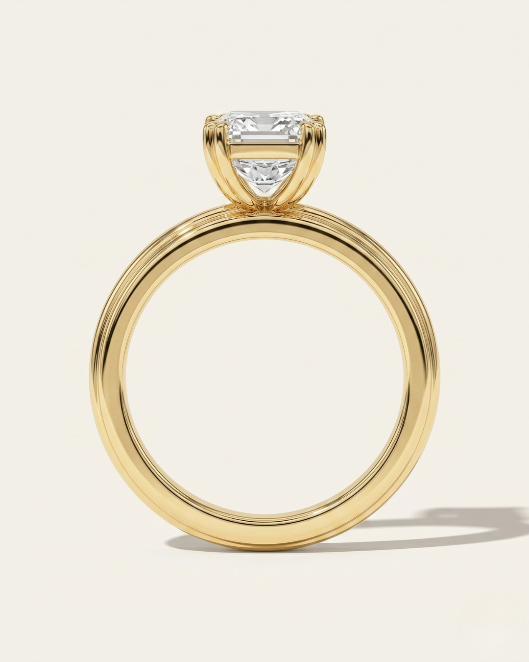 Side profile view of the MOHSTEN Brooklyn engagement ring in 18ct yellow gold showcasing the double-claw basket setting and the distinct fluted band profile.