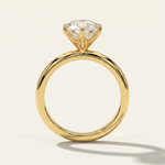 Side profile through-finger view of the MOHSTEN Jaipur round diamond solitaire engagement ring in 18ct yellow gold highlighting the minimalist signature 6-prong setting architecture.