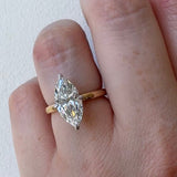 MOHSTEN Niseko marquise diamond solitaire engagement ring modelled on hand, displaying its elongated architectural silhouette and high-polish 1.8mm band.