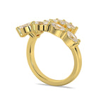 Top-down angle of the 14ct yellow gold Azores Wrap ring showing the parallel bands of emerald and oval cut diamonds.