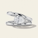 MOHSTEN Beaufort pear diamond double band engagement ring in polished platinum showcasing an east-west oriented pear diamond floating within an architectural split band.