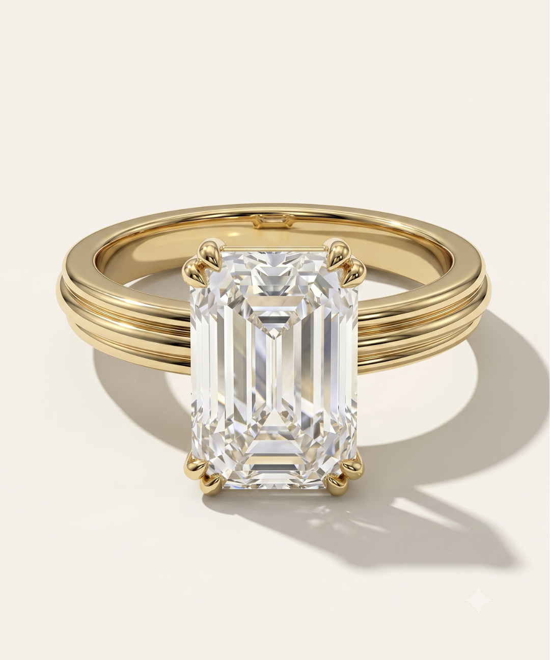 MOHSTEN Brooklyn emerald cut diamond engagement ring in 18ct yellow gold showcasing a classic emerald-cut centre stone on a distinct triple-ridged fluted band