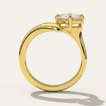 Through-finger circular profile view of the MOHSTEN Granada asymmetric round diamond solitaire engagement ring in 18ct yellow gold, highlighting the clean inner band geometry and the unique low-profile setting architecture casting a crisp studio shadow.