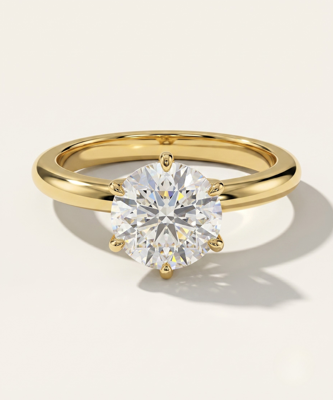 MOHSTEN Jaipur round diamond solitaire engagement ring in 18ct yellow gold showcasing a premium round brilliant centre stone in a minimalist signature 6-prong setting