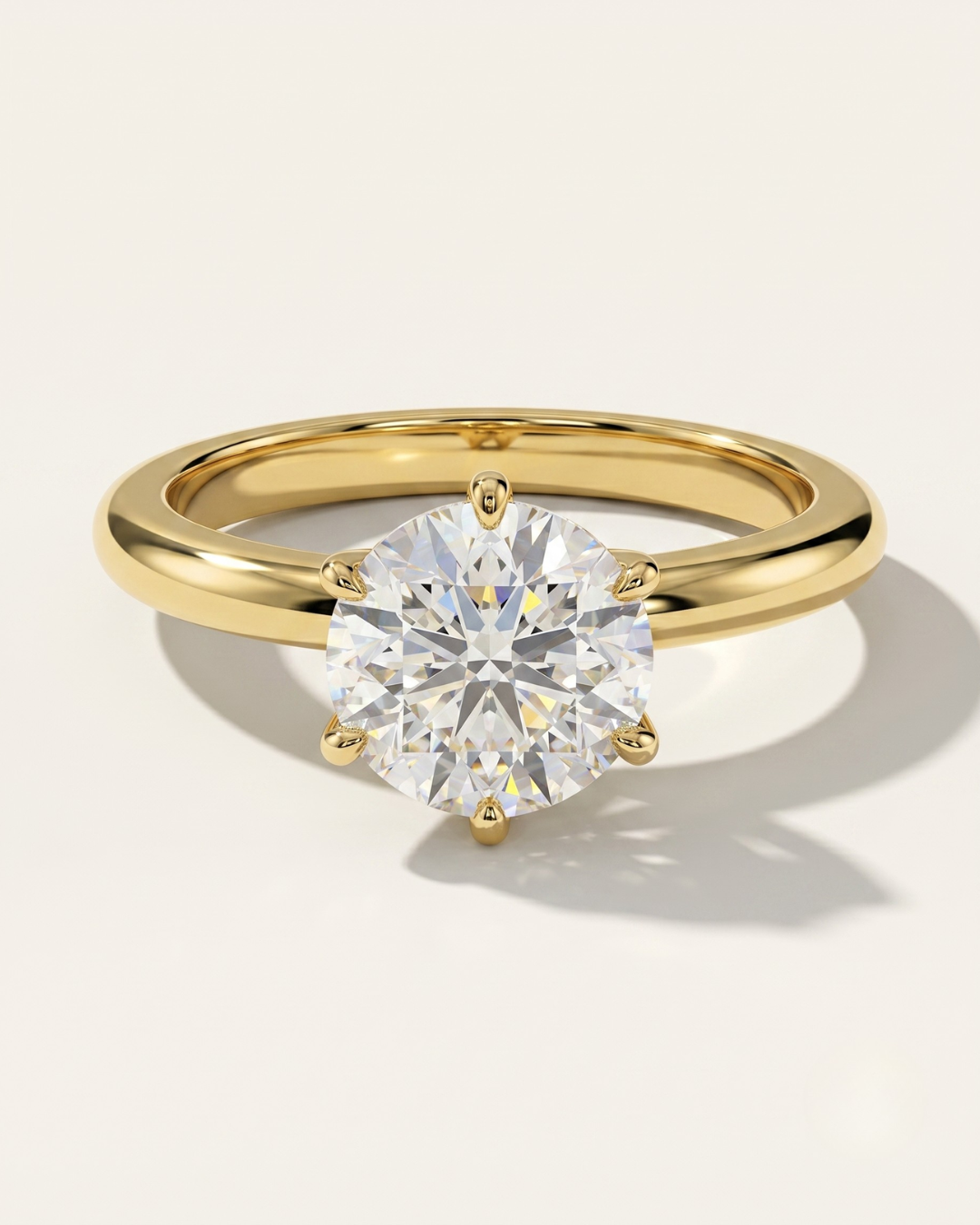 MOHSTEN Jaipur round diamond solitaire engagement ring in 18ct yellow gold showcasing a premium round brilliant centre stone in a minimalist signature 6-prong setting