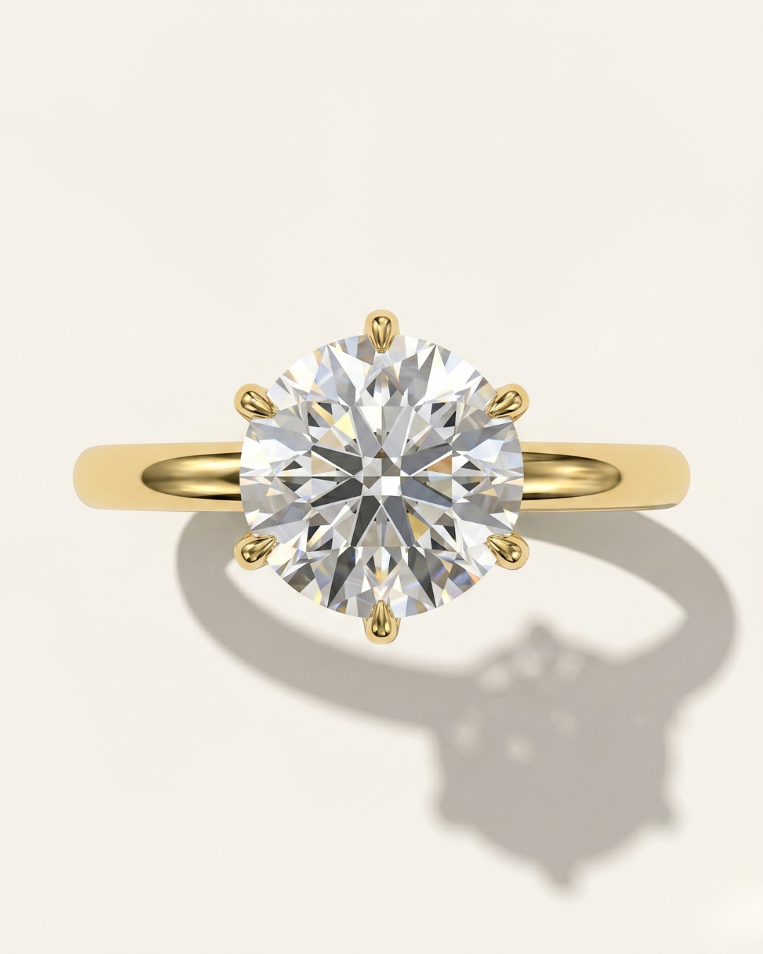 MOHSTEN Jaipur round diamond solitaire engagement ring in 18ct yellow gold showcasing a face-on portrait view of the premium round brilliant centre stone and signature 6-prong setting.