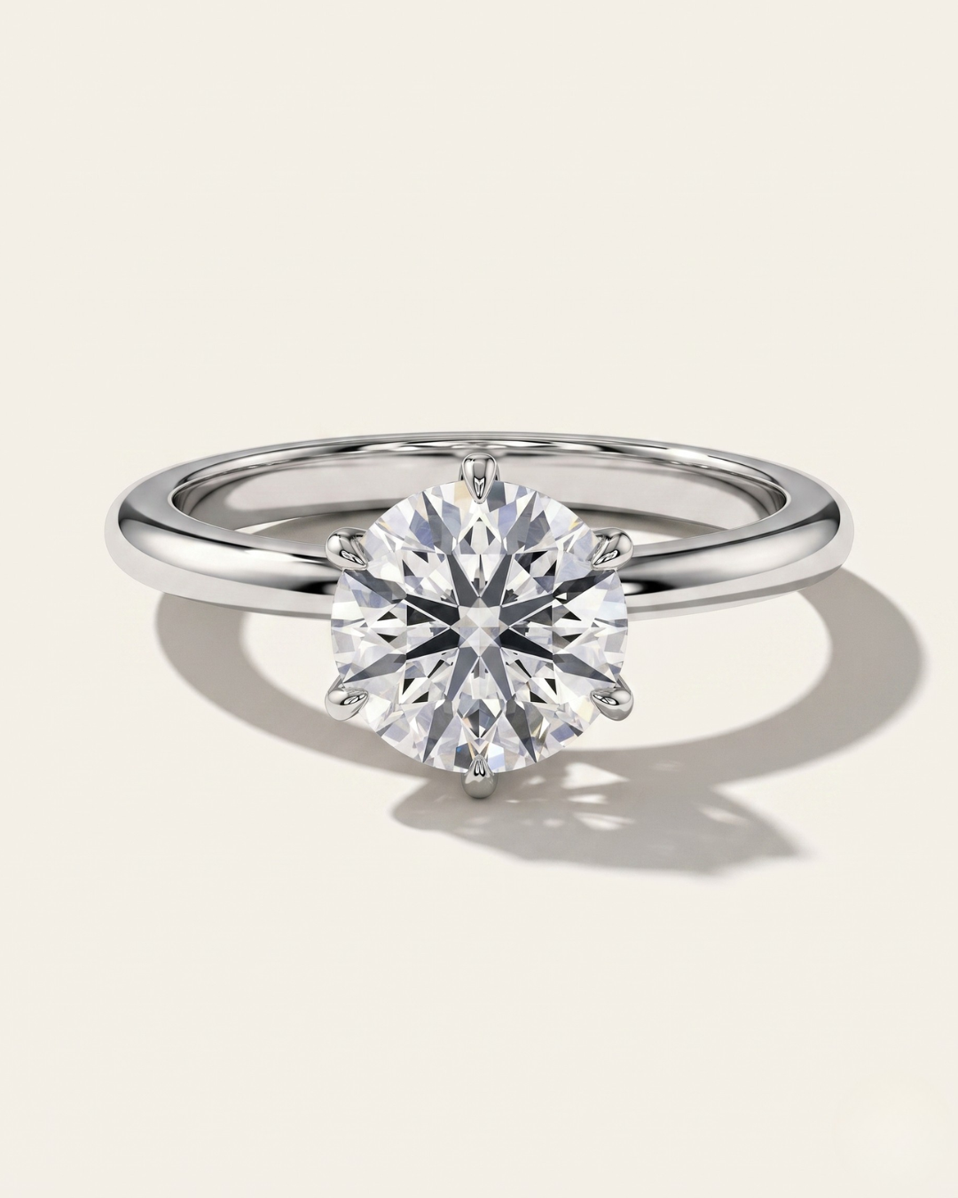 MOHSTEN Jaipur round diamond solitaire engagement ring in polished platinum showcasing a face-on portrait view of the premium round brilliant centre stone and signature 6-prong setting.