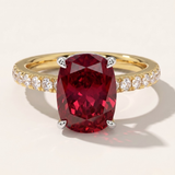 MOHSTEN Manila elongated cushion-cut ruby engagement ring in 18ct yellow gold featuring a solitaire red ruby in a 4-claw floating basket setting on a brilliant diamond-set band.