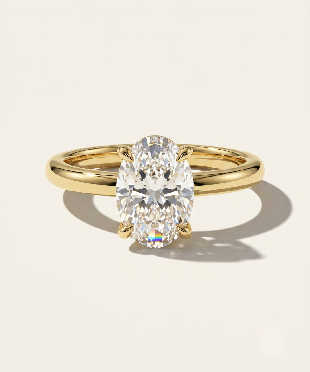 MOHSTEN Osaka oval diamond solitaire engagement ring in 18ct yellow gold showcasing a premium oval brilliant centre diamond in a minimalist signature 4-prong basket setting.