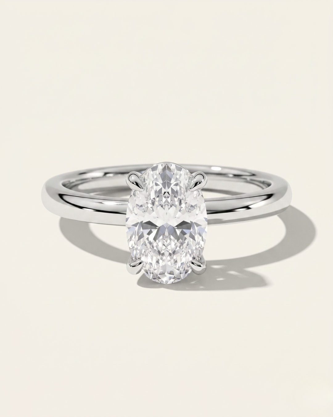 MOHSTEN Osaka oval diamond solitaire engagement ring in polished platinum showcasing a premium oval brilliant centre diamond in a minimalist signature 4-prong basket setting.