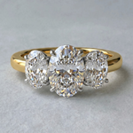 MOHSTEN Sydney oval diamond trilogy engagement ring in 18ct yellow gold showcasing a premium central oval diamond flanked symmetrically by two matching oval side stones.