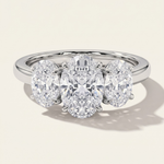 MOHSTEN Sydney oval diamond trilogy engagement ring in polished platinum showcasing three beautifully matched oval-cut diamonds on a sleek cathedral band.