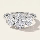 MOHSTEN Sydney oval diamond trilogy engagement ring in polished platinum showcasing three beautifully matched oval-cut diamonds on a sleek cathedral band.