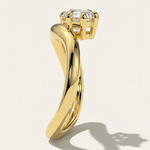 MOHSTEN Venice pear diamond solitaire engagement ring in 18ct yellow gold showcasing a side profile through-finger view of the dramatic sweeping band architecture and low-profile prong setting casting a crisp studio shadow.
