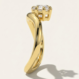 MOHSTEN Venice pear diamond solitaire engagement ring in 18ct yellow gold showcasing a side profile through-finger view of the dramatic sweeping band architecture and low-profile prong setting casting a crisp studio shadow.