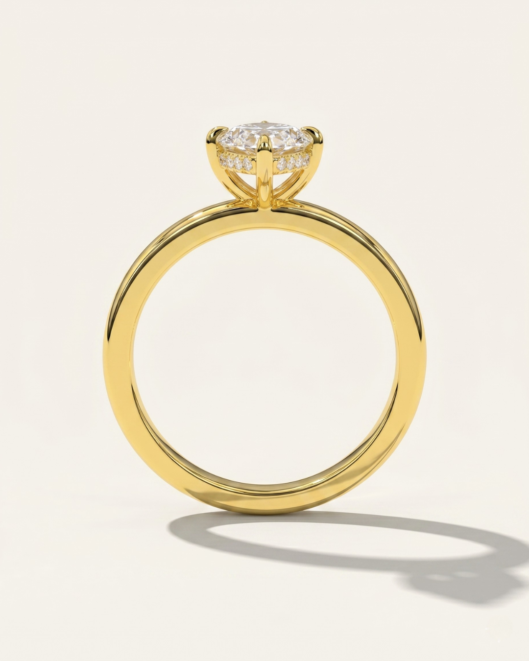 Side profile view of the MOHSTEN Niseko engagement ring highlighting the signature minimalist 4-prong basket and brilliant hidden diamond halo.