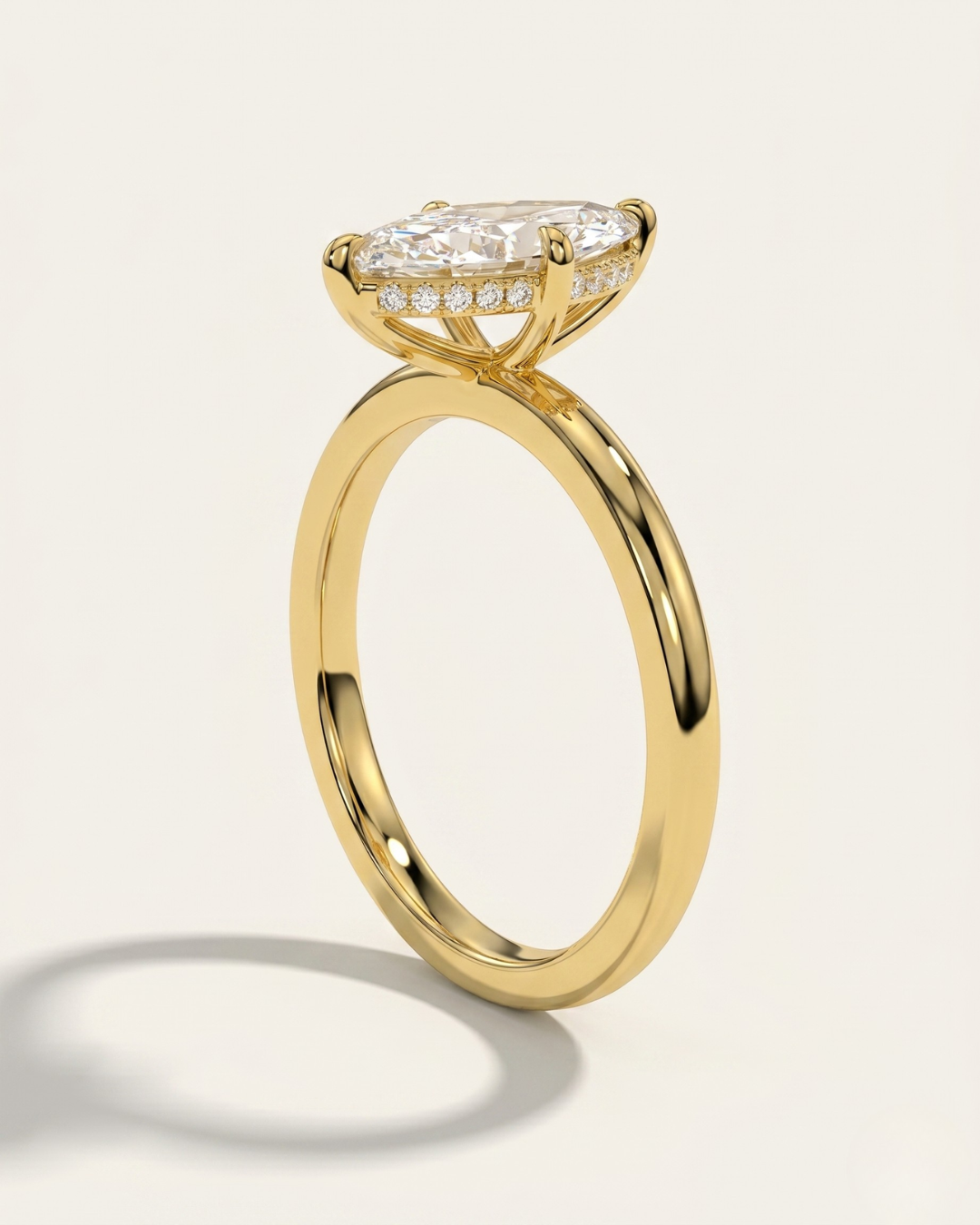 Side angle view of the MOHSTEN Niseko engagement ring highlighting the signature minimalist 4-prong basket and brilliant hidden diamond halo.