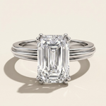 MOHSTEN Brooklyn emerald cut diamond engagement ring in polished platinum displaying the double-claw basket setting and textured band architecture.