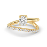 A gold band ring with a central oval-shaped lab-grown diamond and smaller diamonds set around the band.